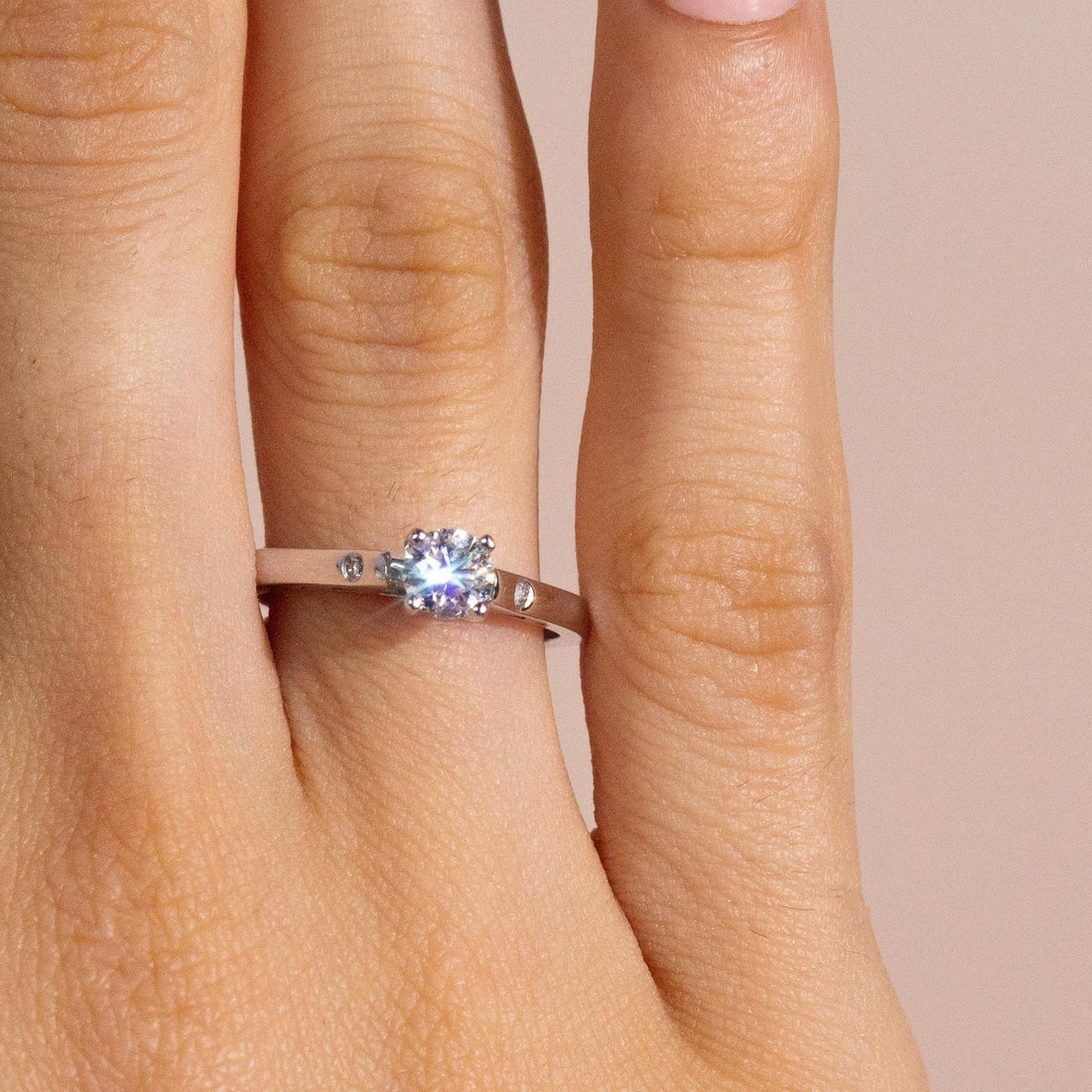 0.4 carat diamond ring on finger, solitaire diamond engagement ring