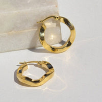 twisted gold hoops, 10k yellow gold twisted hoops light toronto, made in canada, 10k gold hoop earrings affordable canada